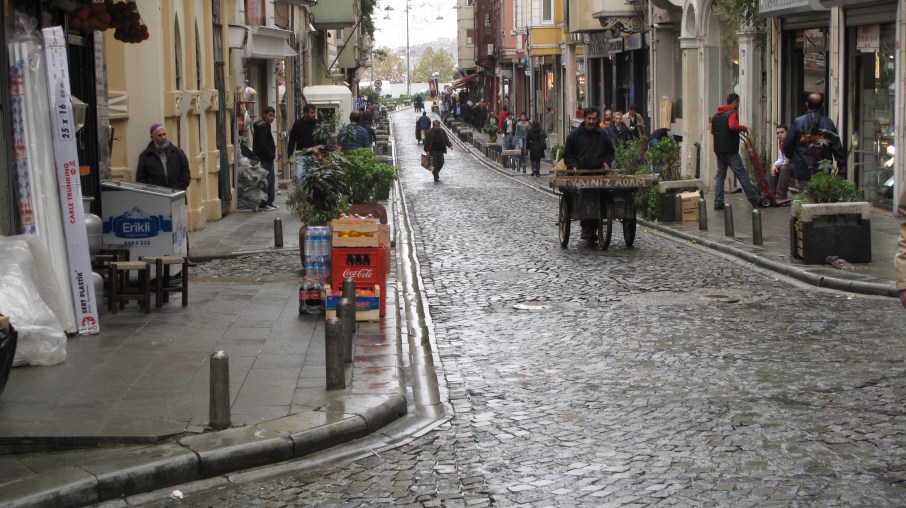 Small street - Coca Cola delivery vs. wooden pushcart